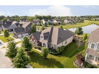 Beautiful home featuring a well-manicured lawn and attractive landscaping at 6337 Ederline Ln, Noblesville, IN 46062