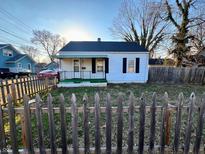 Charming one-story home featuring a covered porch and picket fence at 640 S Sycamore St, Martinsville, IN 46151