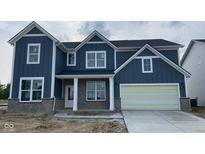 Charming two-story home with a blue exterior and a two-car garage with appealing architectural details at 6462 Stone Side Dr, Plainfield, IN 46168