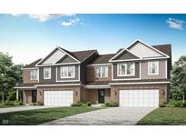 Charming new construction townhome featuring brick and siding with a two-car garage and beautiful landscaping at 2922 Woods Edge Dr, Greenwood, IN 46143