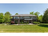 Stunning two-story home featuring a modern design, manicured lawn, and lush landscaping for enhanced curb appeal at 4691 Pascagoula Run, Greenwood, IN 46143
