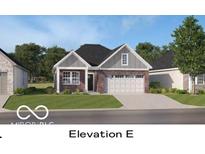 Charming single-story home with brick accents, a manicured lawn, and an attached two-car garage at 611 Bridgeman Rd, Avon, IN 46123