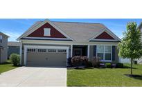 Charming single-story home with a two-car garage, manicured lawn, and lovely landscaping at 1349 Sunset Blvd, Avon, IN 46123