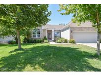 Charming single-story home featuring a well-maintained lawn and inviting curb appeal at 6110 Pelican Ln, Columbus, IN 47201