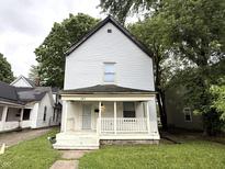 Charming two-story home with a covered front porch and traditional design at 745 N Tremont St, Indianapolis, IN 46222