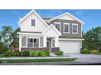 Charming two-story home boasts a two-car garage and a beautifully landscaped front yard with flowering bushes at 8856 Alexander Ridge Dr, McCordsville, IN 46055