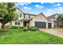 Charming two-story home with well-manicured lawn and a spacious driveway at 2623 Senators Way, Indianapolis, IN 46217