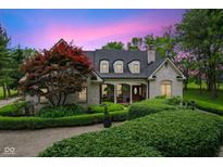 Charming single-Gathering home showcasing manicured landscaping and a welcoming entrance at twilight at 2953 Foxborough Dr, Greenwood, IN 46143