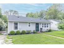 Charming single-story home with a well-manicured lawn and neatly trimmed shrubbery at 305 W Vinyard St, Anderson, IN 46011