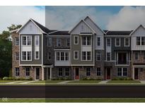 New townhome row with brick and vinyl siding, multi-pane windows, and contrasting trim at 412 Elite St # 2-601, Westfield, IN 46074