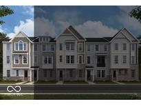 Charming townhomes featuring a mix of siding and brick, with ample windows and a welcoming facade at 412 Elite St # 2-601, Westfield, IN 46074