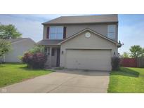 Classic two-story home with a spacious two-car garage and lovely front yard at 6637 Larkwood Ct, Indianapolis, IN 46241