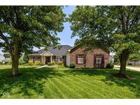 Charming brick ranch home with beautiful lawn and mature trees offering great curb appeal at 1854 Oconnor Ct, Avon, IN 46123