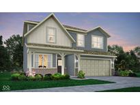 Inviting two-story home with a neutral color palette, two-car garage, well-manicured landscaping, and charming front porch at 19831 Moorpark Lndg, Noblesville, IN 46062