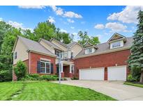 Beautiful two-story brick home featuring a spacious driveway and manicured lawn with a basketball hoop at 2592 Highmount Ct, Carmel, IN 46033