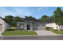 Charming single-story home with a two-car garage, gray siding, stone accents and a well-manicured lawn at 633 Bridgeman Rd, Avon, IN 46123