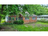 Charming brick home with mature trees, offering a serene setting and classic appeal at 6580 N Us Highway 31, Whiteland, IN 46184