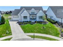 Beautiful two-story home featuring a manicured lawn and a welcoming front porch at 987 Oak Terrace Rd, Westfield, IN 46074