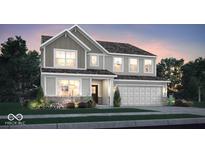 Charming two-story home featuring board and batten siding, a two-car garage, and professionally landscaped yard at 3080 Glasgow Pl, Danville, IN 46122