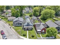 Charming homes showcase well-maintained lawns and mature trees in a peaceful residential neighborhood at 3636 Crescent Ave, Indianapolis, IN 46208