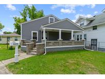 Charming single-Gathering home featuring a covered front porch and well-maintained lawn at 3636 Crescent Ave, Indianapolis, IN 46208