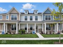 Charming townhome showcasing a well-manicured lawn and a welcoming front porch at 3931 Wren Dr, Brownsburg, IN 46112