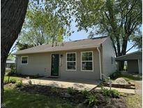 Charming one-story home with a well-maintained lawn and landscaping, creating a welcoming curb appeal at 409 Parkway St, Whiteland, IN 46184