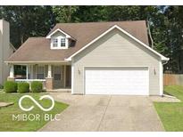 Charming single-Gathering home with a well-manicured lawn and a two-car attached garage at 5240 Ochs Ave, Indianapolis, IN 46254