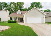 Charming single Gathering home with a front porch, lawn, and a two-car garage at 5240 Ochs Ave, Indianapolis, IN 46254