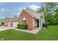 Charming brick home with lush lawn, well-maintained shrubs, and inviting front entrance with house number at 5939 Oberlies Way, Plainfield, IN 46168