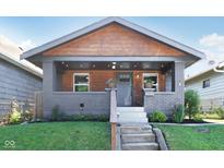 Charming craftsman-style home featuring a covered porch and a wood-accented gable at 1421 S New Jersey St, Indianapolis, IN 46225