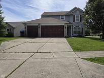 Charming two-story home with a spacious driveway and attached two-car garage at 2248 Salem Park Dr, Indianapolis, IN 46239