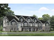 New construction townhome featuring gray siding, black roofing and trim and brick facade at 5790 Arcade Blvd, McCordsville, IN 46055