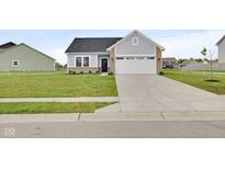 Charming single Gathering home with a large front yard and two car garage with ample parking at 637 N Quartz Ln, Fortville, IN 46040