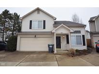 Two story home with neutral siding, two car garage and black shutters at 708 Mountain Pine Dr, Greenwood, IN 46143