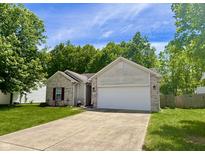 Charming exterior with brick accents, lush lawn, and attached two-car garage at 167 Hilltop Farms Blvd, New Whiteland, IN 46184