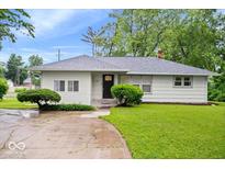 Charming one-story home with a well-manicured lawn and inviting curb appeal at 2105 Mayfair Dr, Indianapolis, IN 46260