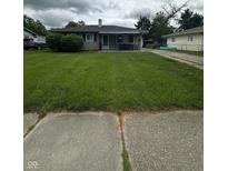 Charming single-story home with a well-maintained lawn and inviting curb appeal at 4113 W 30Th St, Indianapolis, IN 46222