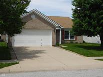 Charming single-Gathering home with brick facade, attached garage, and well-maintained lawn at 8346 Weathervane Cir, Indianapolis, IN 46239