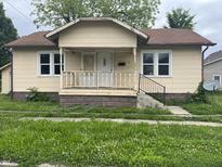 Charming single-story home with covered porch and visible street number at 1020 E 30Th St, Anderson, IN 46016