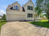Two-story home features a two-car garage, dormer windows, and a well-maintained lawn at 11753 Pawleys Ct, Indianapolis, IN 46235