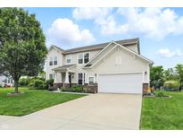 Charming two-story home with a well-manicured lawn and attached two-car garage at 1281 Jesse Ct, Greenwood, IN 46143