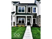 Charming two-story home with black shutters, well-maintained lawn, and front walkway at 19450 Northwest Dr, Westfield, IN 46074