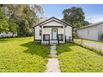 Charming single-story home featuring a quaint front porch and a well-manicured lawn at 2631 Collier St, Indianapolis, IN 46241