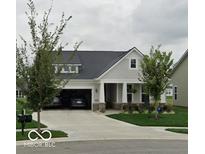 Charming single-story home featuring a welcoming front porch and an attached two-car garage at 4743 Cleome Dr, Plainfield, IN 46168
