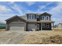 Two-story home featuring a two-car garage, brick and shingle siding, white trim, and professional design at 6032 Granby Dr, Whitestown, IN 46075