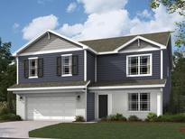 Charming two-story home featuring navy blue siding and a white brick foundation with an attached two-car garage at 61 Benfield Dr, Whiteland, IN 46184
