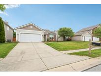 Charming single-Gathering home with a two-car garage and well-manicured lawn in a suburban neighborhood at 12496 Wolf Run Rd, Noblesville, IN 46060