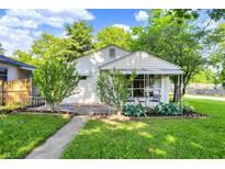 Charming single-Gathering home with a well-maintained lawn and inviting front porch at 1868 N Hawthorne Ln, Indianapolis, IN 46218