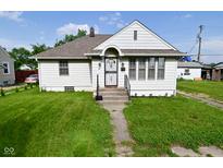 Charming single-story home featuring a well-maintained lawn and inviting front porch at 341 Barton Ave, Indianapolis, IN 46241